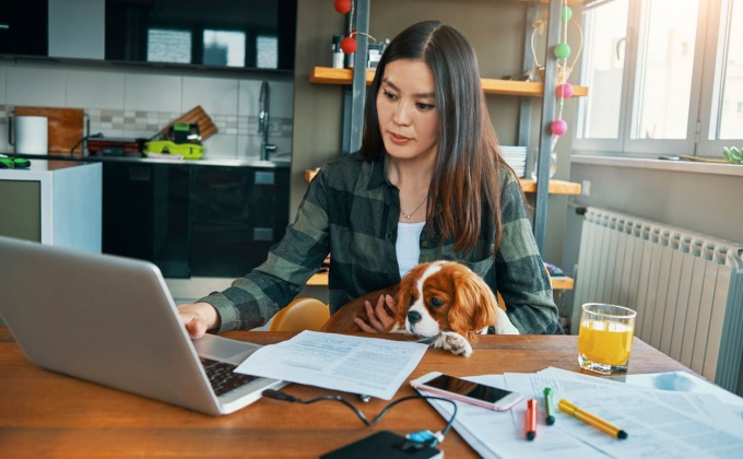 Photo of a woman working from her home office
